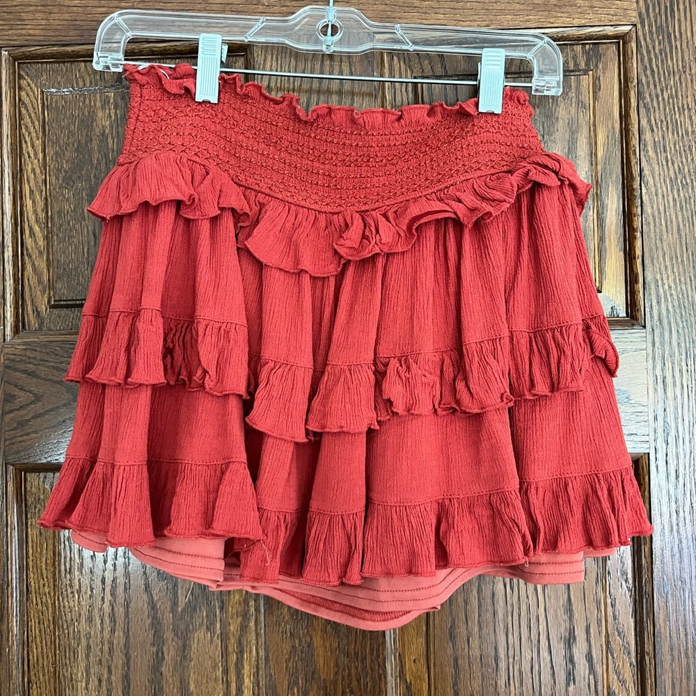 Reddish orange ruffle skirt